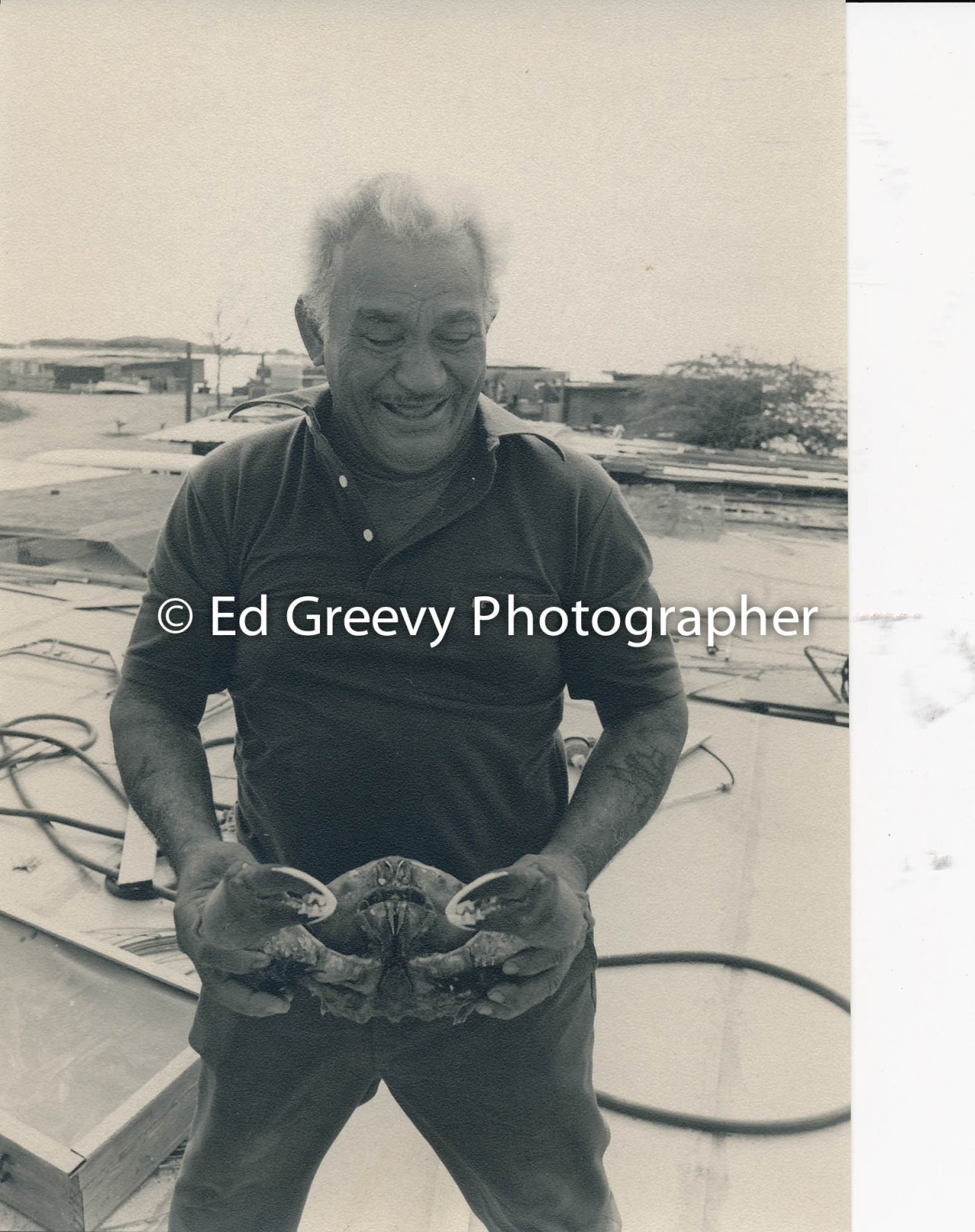 Sand Island resident Clement Apollo with crab    (11 November 1979) Negative: 4091-1-12 | Ed Greevy Photographer