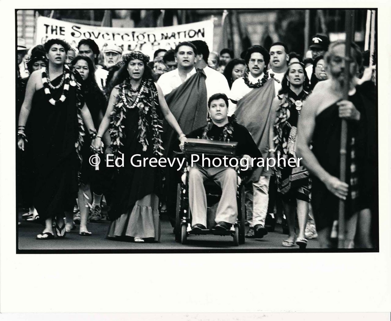 Lilikalā Kame'eleihiwa (left), Mililani Trask, Kanalu Young, and Haunani-Kay Trask lead march to Iolani Palace to protest the 1893 overthrow of the Hawaiian Kingdom (1993) | Ed Greevy Photographer