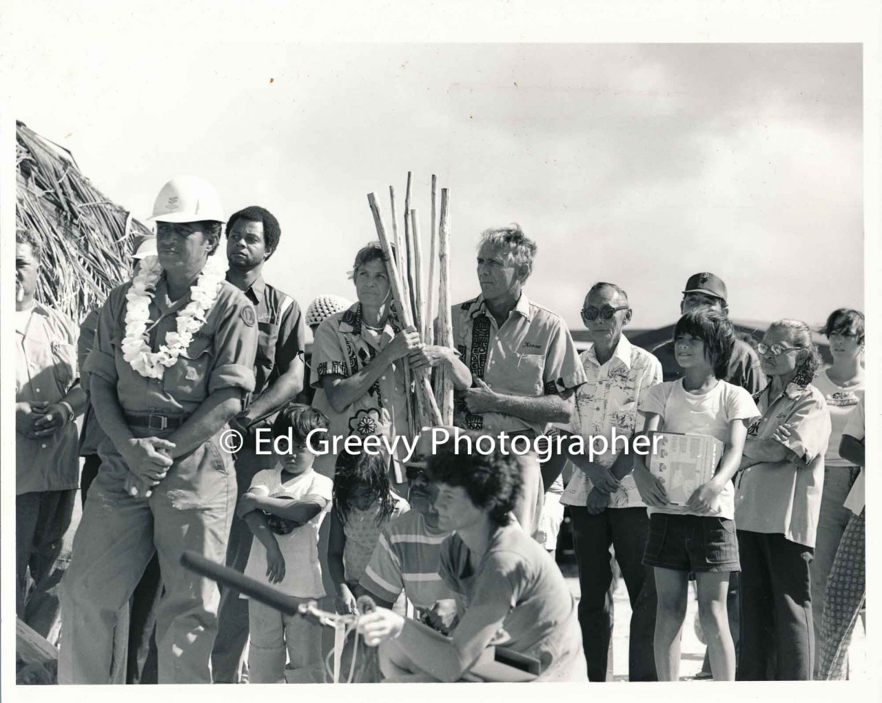 John and Marion Kelly (center) observe dedication of pre-contact canoe on Mokauea Island. Also, Inchan Canencia, Herbert Yamada, Esmond Kilaulani, Valisa Kilaulani, Jack Peterson and  Junior Pauahi