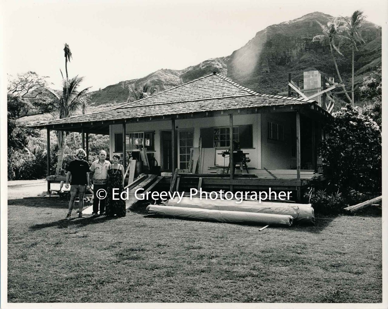 Stanford and June Achi at their Niumalu-Nawiliwili home, repaired after Hurricane Iwa damage. With them is the Oregon carpenter who helped restore their home. (7 December 1983) Negative: 6021-1-4 | Ed Greevy Photographer