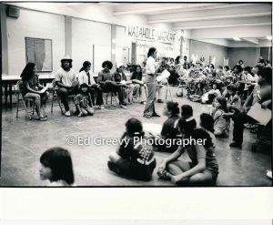 Terri Kekoʻolani leads youth group skit opposing re-zoning- n Waiahole-Waikane at King Intermediate School (21 October 1974) Negative: 2752-9-19 | Ed Greevy Photographer
