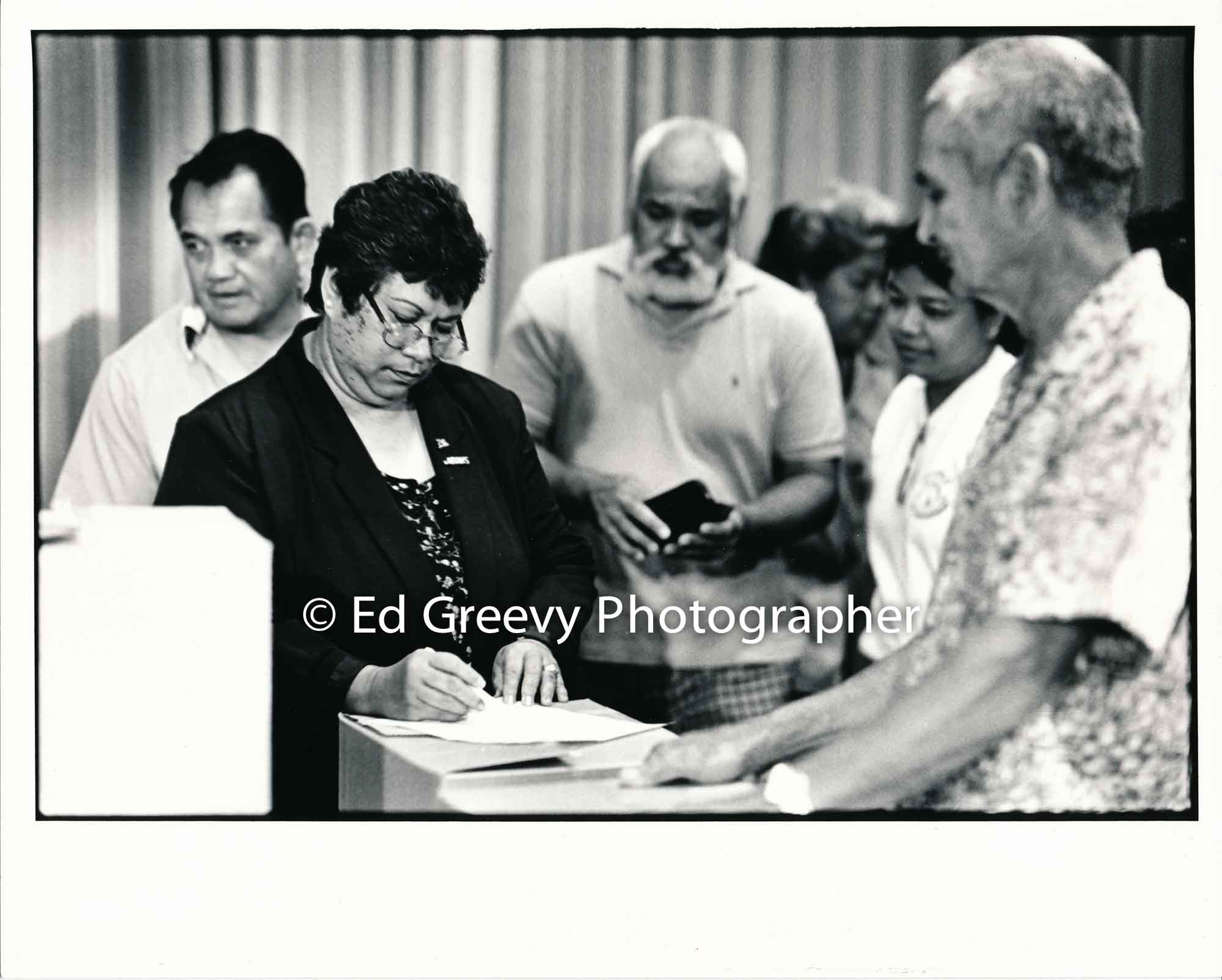 Waiahole-Waikane residents from left: Joe Royos, Hannah Salas, Albert Badiyo, Nellie Dano, and Bernie Lam Ho sign their state leases at Waiahole school.