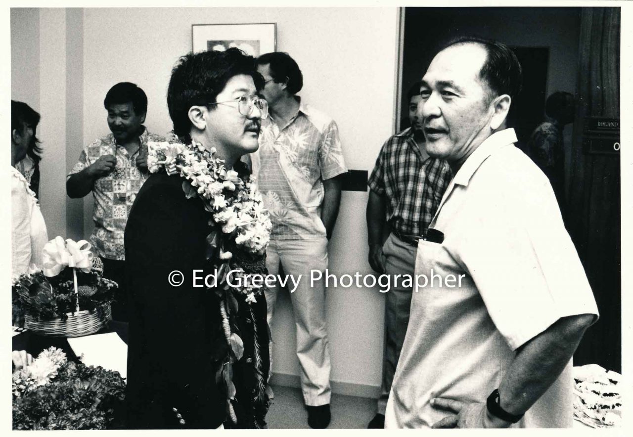 Roland Kotani with well-wisher at Hawaiʻi State Legislature opening day. 1989