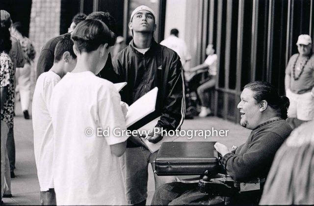 Kanalu Young, in chair, speaking with students at state capitol protest | Ed Greevy Photographer