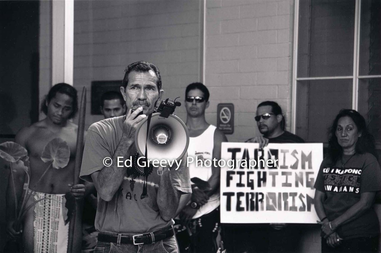 Walter Ritte speaks at UH Manoa protest demo about patenting taro. (2007) | Ed Greevy Photographer