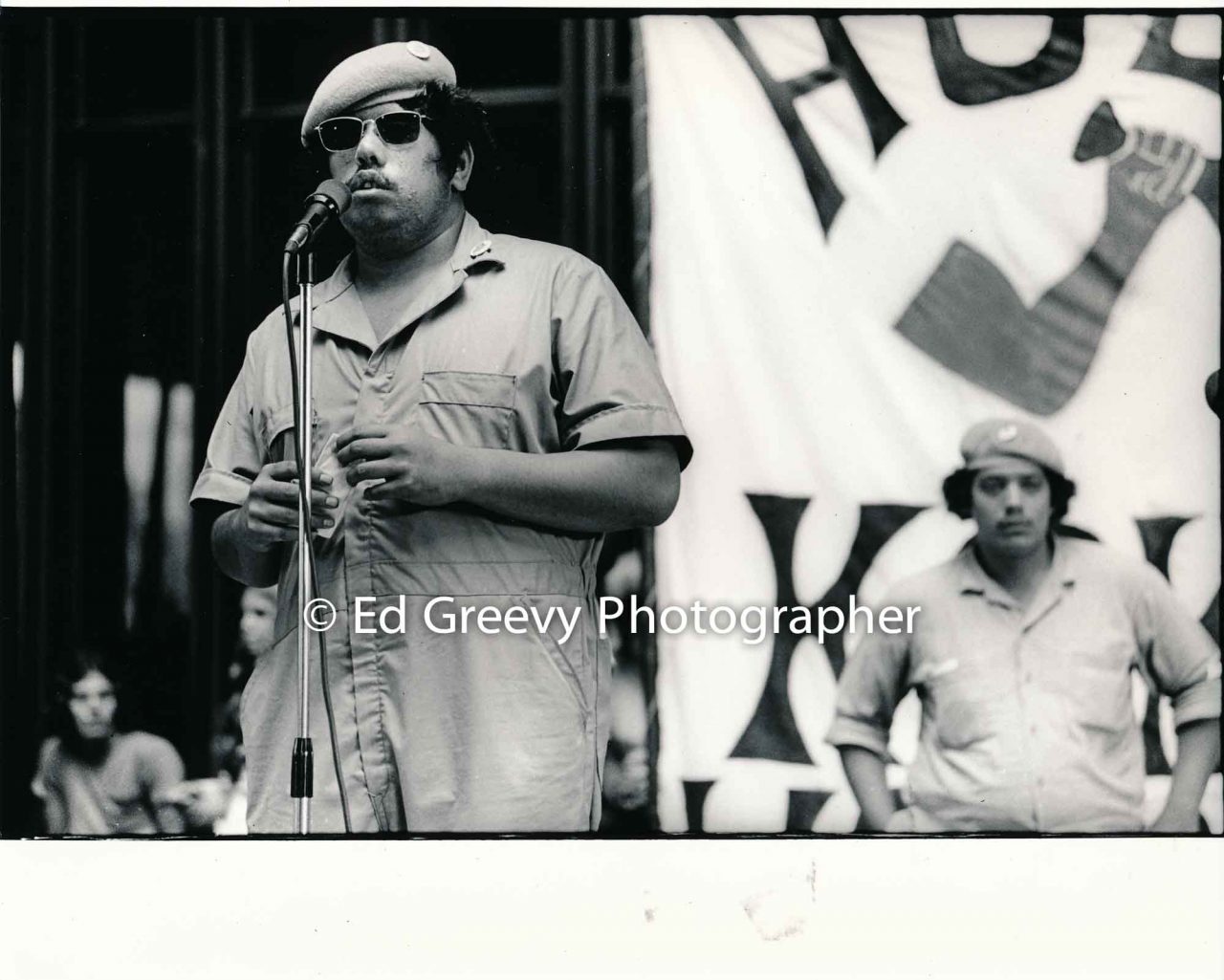 Kokua Hawaiʻi member Kalani Ohelo addresses protesters at SOS-Kokua Hawaiʻi demonstration at the state capitol (31 March 1971) Negative: 2320-5-2a | Ed Greevy Photographer