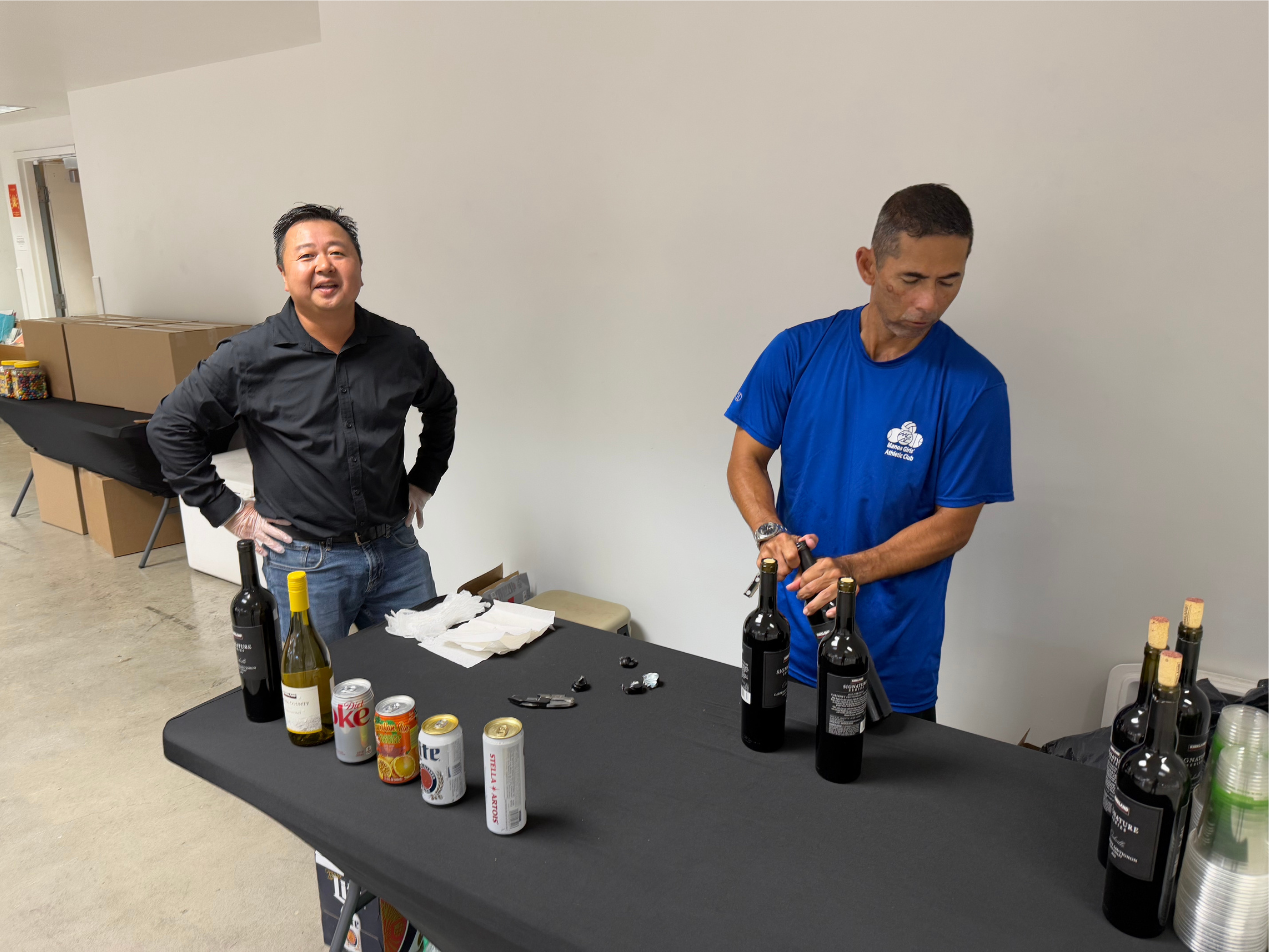 Longtime friends and baseball teammates from McKinley High School, Gary Harada (left) and Kris Yahiku, volunteered to staff the refreshments table.